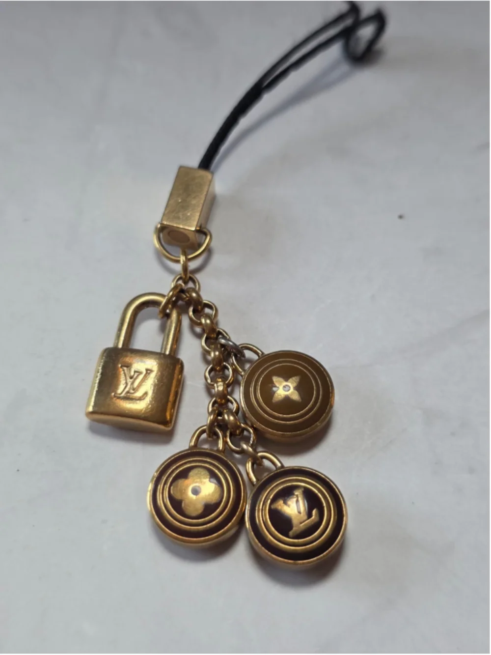 Louis Vuitton Gold-Tone Monogram Lock & Charm Phone Strap